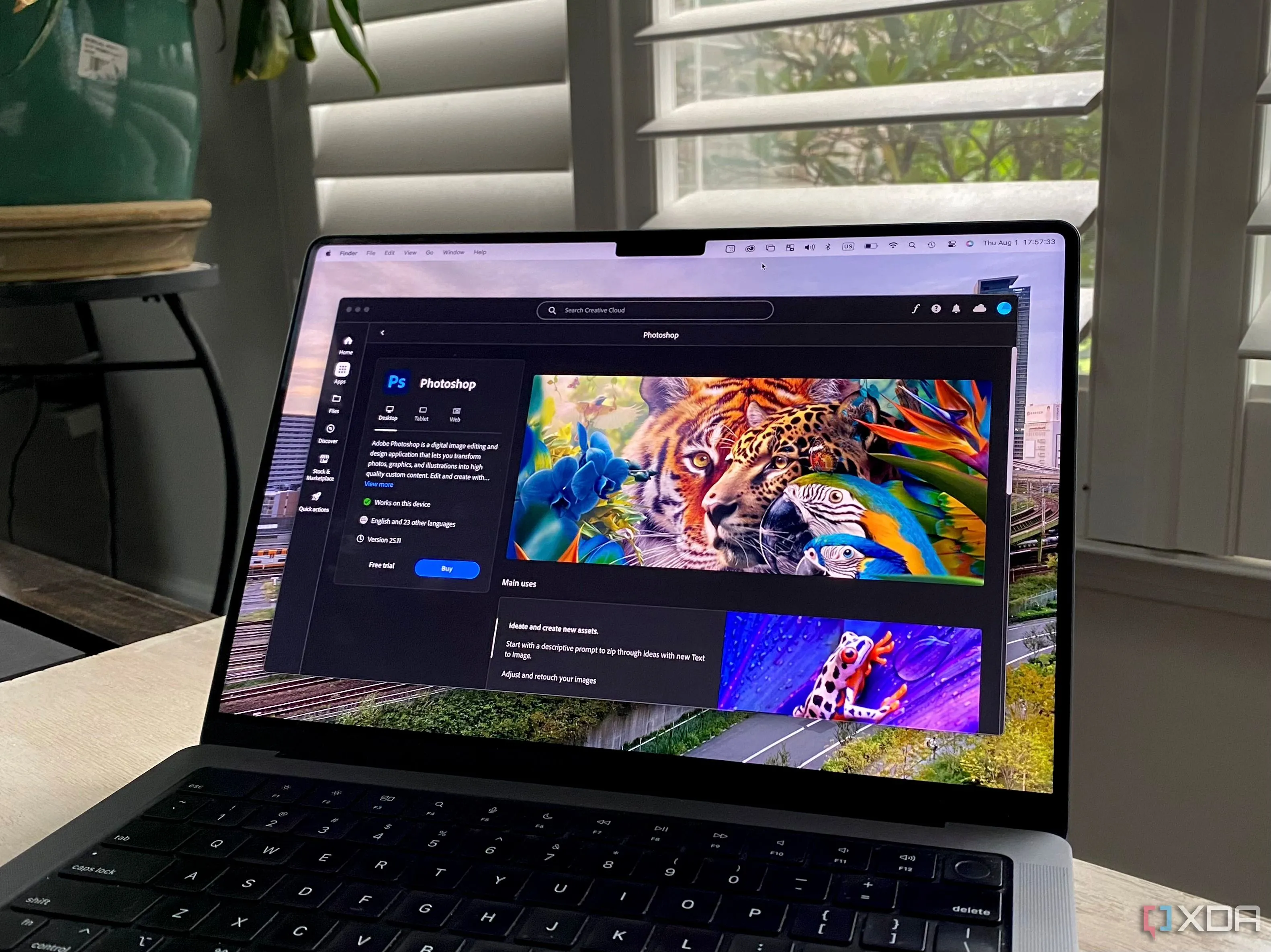Giao diện Adobe Creative Cloud mở trên MacBook Pro hiển thị Photoshop và các ứng dụng khác